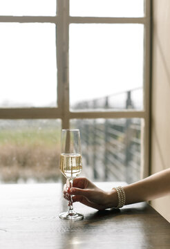 champagne glass window reflection hand jewelry bracelet