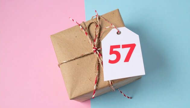 Nicely wrapped birthday present. Paper label with number 57 on it