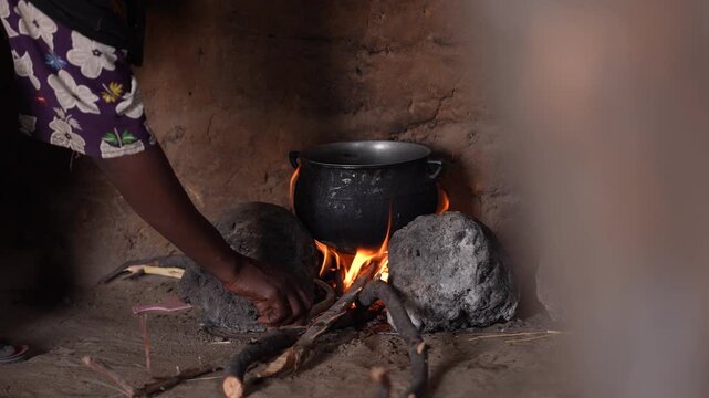 Close up of traditional African food cooking over open fire, April 25, 2026, Chad, N Djamena
