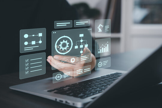 Business process automation dashboard with workflow charts, task tracking and analytics panels on virtual interface above laptop, representing digital operations, process control and efficiency improv