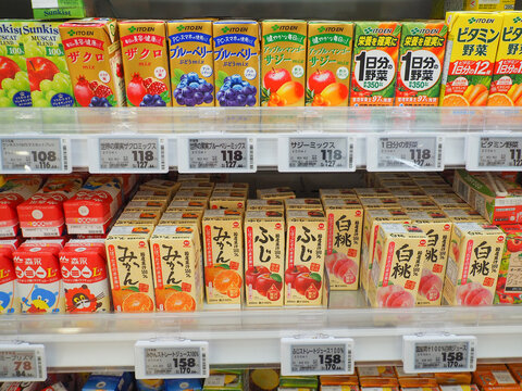CHIBA, JAPAN - May 5, 2026: Cartons of drinks, mostly fruit juice, in a supermarket refrigerator.