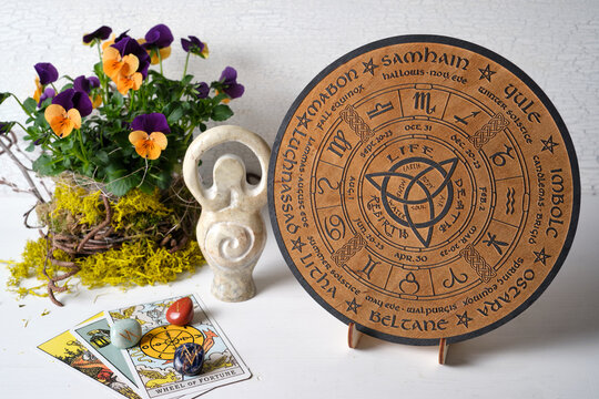 Wheel of the Year engraved with the eight pagan festivals. Spiritual and wicca concept.