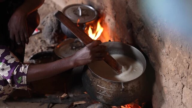 Close up of traditional African food cooking over open fire, April 25, 2026, Chad, N Djamena
