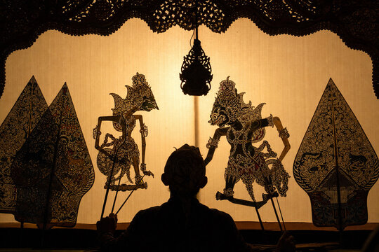 Traditional Indonesian Wayang Kulit Shadow Puppet Performance with Dalang and Cultural Heritage Art