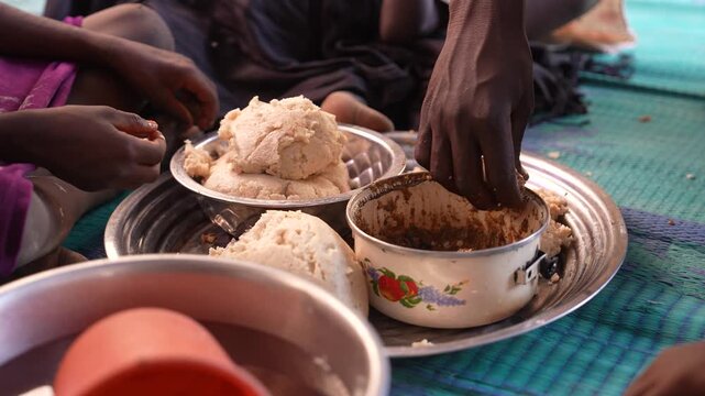 Traditional African meal served in bowls for family dining, April 25, 2026, Chad, N Djamena