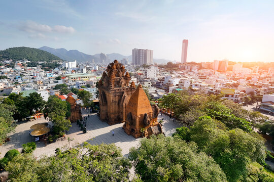 Aerial view of Ponagar tower in city at morning time among the urban development. Vietnam, Nha Trang.