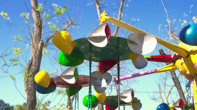 rotating elements of children carousel, close-up, slow motion
