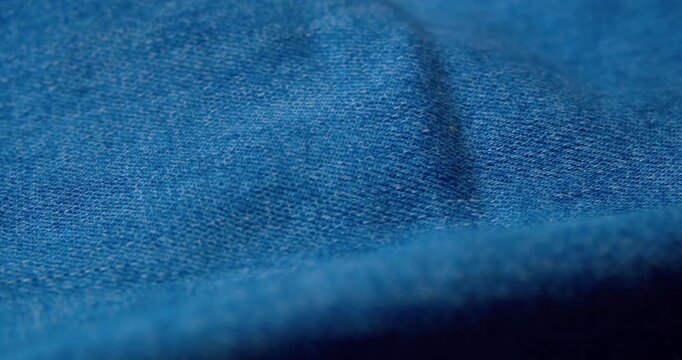 Macro shot of crumpled denim fabric.Abstract background.