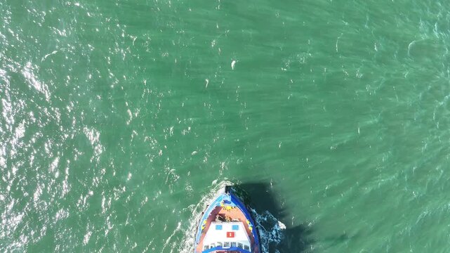 Work Tog boat sailing into view off the north coast of northern ireland