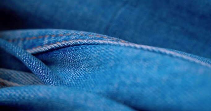 Close-up video of rumpled denim fabric.Abstract background.