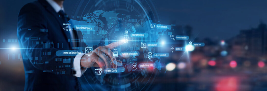 Software integration. Developer hand touching API words and icons on a virtual panel. Streamlining application communication and efficient data exchange across multiple platforms.