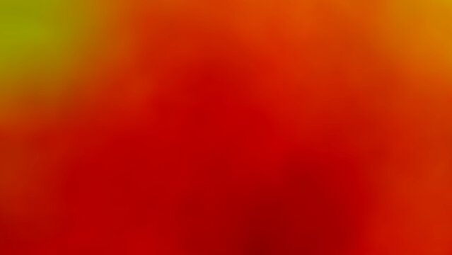 An abstract plastic leaf background image used to decorate a restaurant in a five-star hotel on Silom Road, Bangkok, Thailand. The background image features a blurred gradient of light green, red, yel