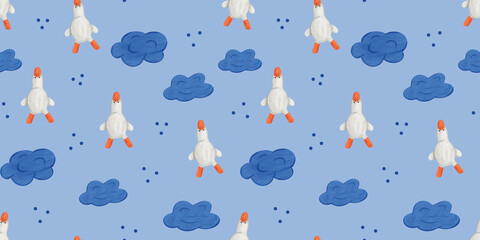 Colorful seamless pattern with geese and clouds on blue fabric background © Olena