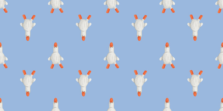 Geese in a repeated pattern on a light blue fabric for crafts and designs