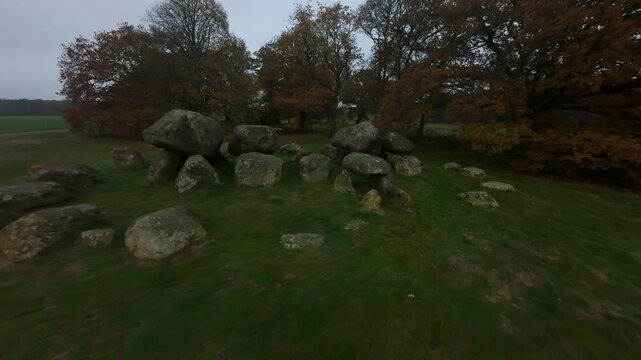 Aerial view flying around ancient dolmen prehistoric megalithic tomb