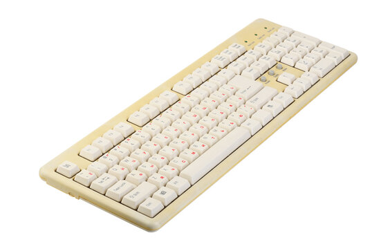 Vintage computer keyboard from the 1990s isolated on white background.