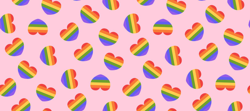 Vector cartoon illustration of a seamless pattern with rainbow heart symbols on a pink background. Colorful LGBTQ pride love concept