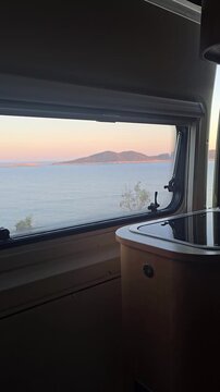 Enjoy breathtaking sunset vistas over the tranquil sea in Kas, Turkey. camping in a camper van or motorhome at the seaside on a cliff