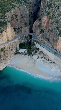 Discover the breathtaking coastline of Kas, Kaputas Beach, Turkey. This stunning location features crystal-clear waters, rocky cliffs, and serene beaches perfect for relaxation and exploration.