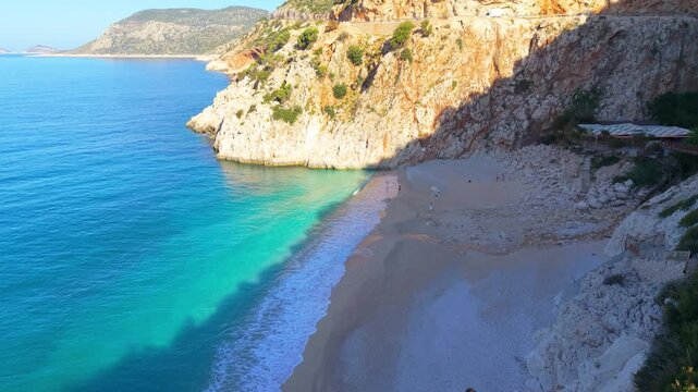 A couple of man and woman at Kaputas Beach Kas, Turkey, where sun-kissed beaches meet turquoise seas. Ideal for summer holidays and unforgettable vacations, this location is a paradise for travelers.