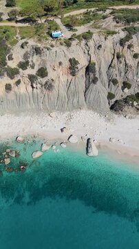 Experience the natural beauty of Kas, Turkey, where crystal-clear turquoise waves meet dramatic rocky cliffs.