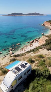 Explore the stunning coastline of Kas, Turkey, featuring crystal-clear waters and scenic views. A cozy campervan sets the stage for relaxation and adventure in this beautiful holiday destination.
