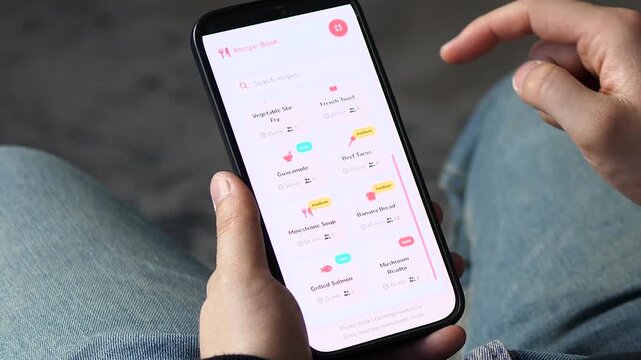 Browsing a recipe book app on a smartphone. The grid displays dishes like Spaghetti Carbonara, Chicken Curry, and Greek Salad. Perfect for cooking apps, meal planning, and food lifestyle content.