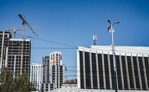 KYIV, UKRAINE - MAY 05, 2026: Exterior facade of a modern multi-story office building and business center located near the NSC Olimpiyskiy in central Kyiv under a clear blue sky.