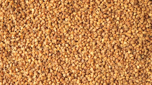 Raw buckwheat groats moving in slow motion
