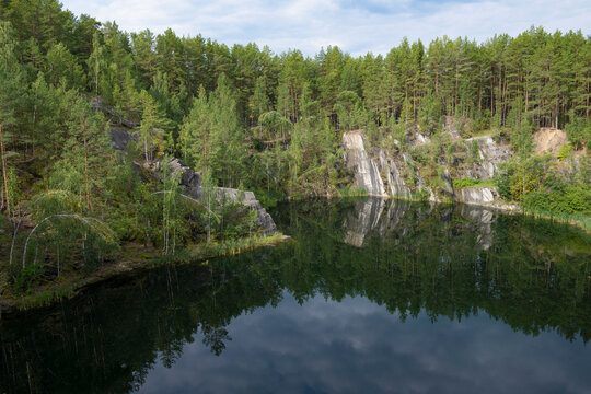 On Talkov Kamen lake on a sunny August day. Bazhov Places nature park. The surroundings of the city of Sysert. Sverdlovsk region, Russia