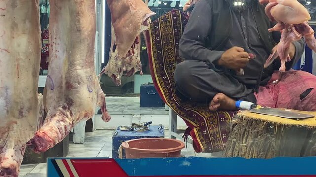 Afghan Butcher Shop Kabul market. Close-up of a butcher preparing lamb and mutton on a traditional wooden block. Fresh carcasses, halal meat, and authentic food culture