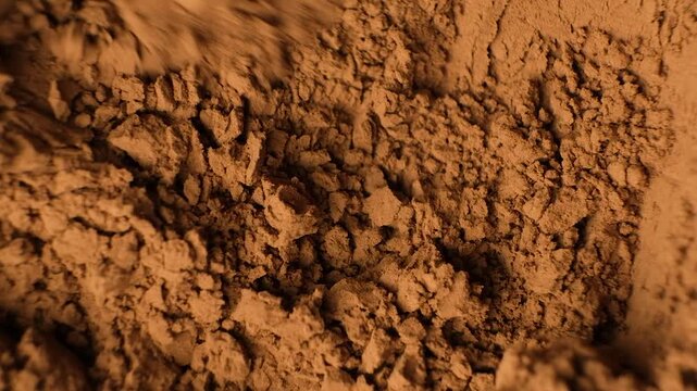 Demonstration of macro texture of natural organic cocoa powder top view.