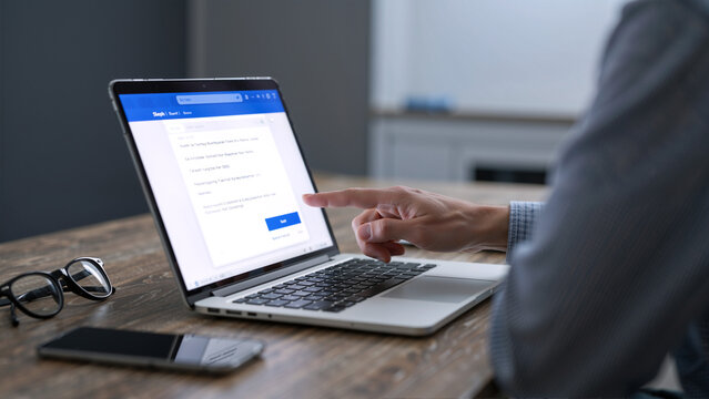 Person using a laptop to send an email
