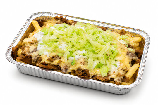 Dutch kapsalon with doner kebab fries in aluminum takeaway tray isolated on white