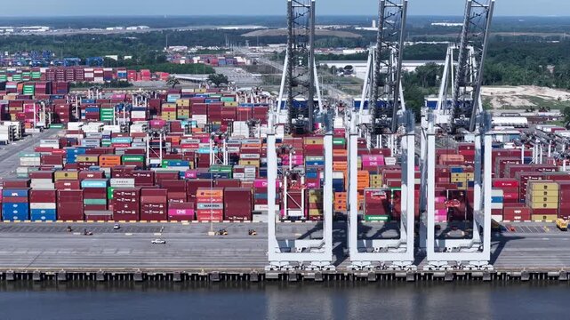 Industrial Shipping Activity and towers at Savannah Ports Authority with containers awaiting transport