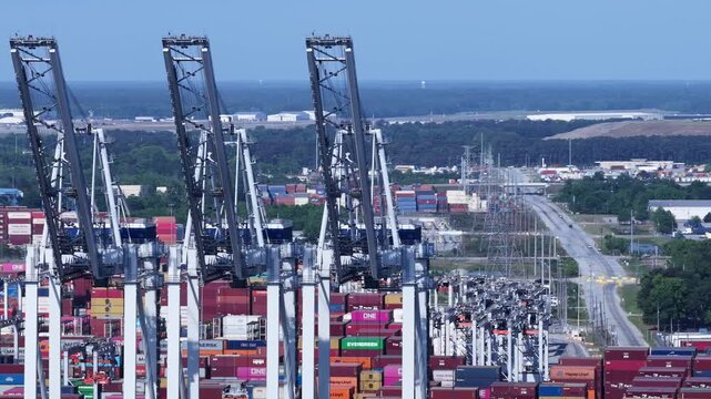 Industrial Shipping Activity and towers at Savannah Ports Authority with containers awaiting transport