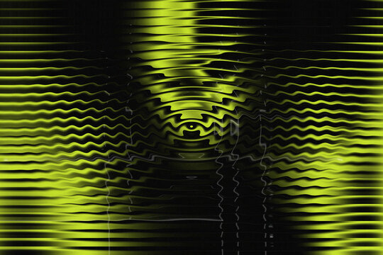Glowing yellow distorted light effect on black background