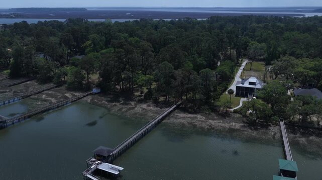 Living in homes and real estate by the Moon River in Savannah, Georgia with docks and natural wetland tidal marsh river