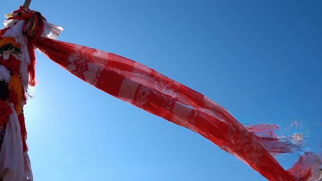Sacred cloth ribbon under blue sky minimalist festival concept