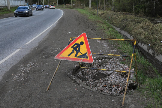 a road sign warning that the highway is being repaired