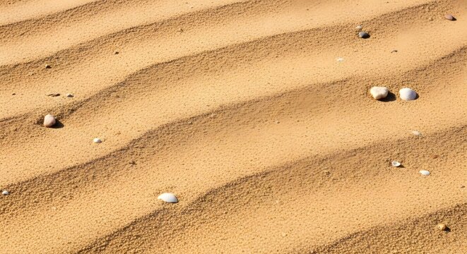 Saudi cultura wavy sand texture with small stones and pebbles on surface