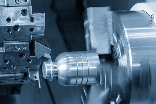 High-precision surface finishing process of a metal mandrel part using a CNC lathe machine in a light blue scene.