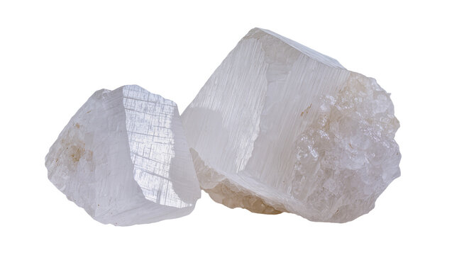 Two clear calcite mineral crystals with striations, isolated on transparent background