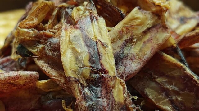 Dried squid on a basket.