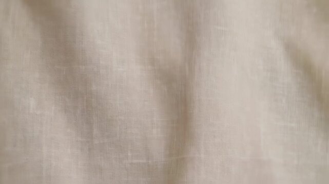 Fabric texture gently shifting in soft light