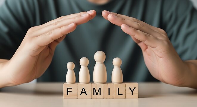 Family insurance protection concept, hands sheltering wooden peg dolls on blocks, life and health security coverage for parents and children