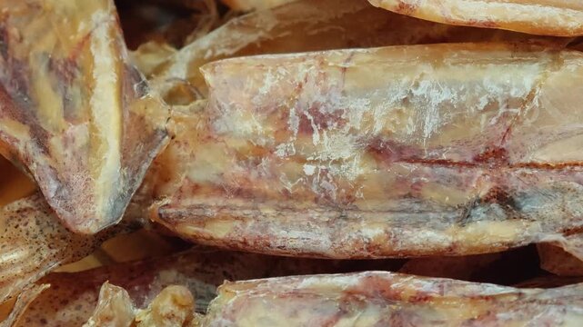 Dried squid on a basket.