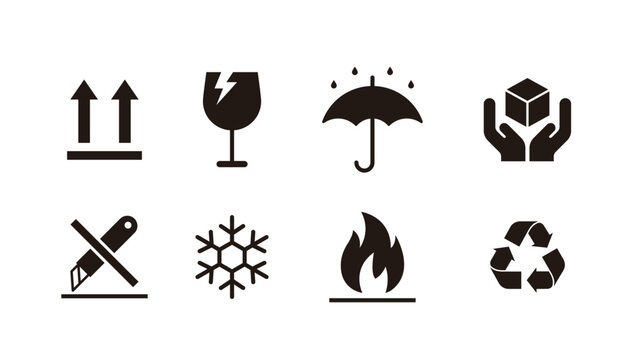 Set of packaging and shipping symbols for cargo handling. Black icons including fragile, keep dry, this side up, flammable, and recycle signs for warehouse logistics and product packaging design.