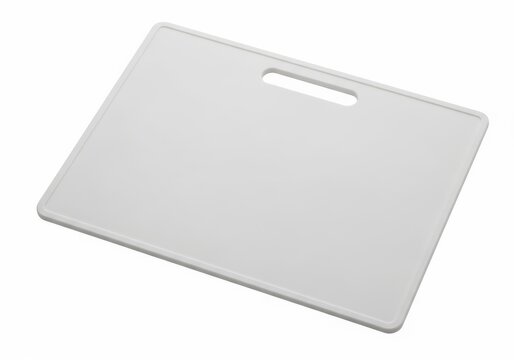 A white plastic cutting board with a handle and a hole for hanging