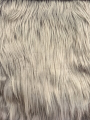 Naklejka premium Close-up texture of soft, fluffy, light gray faux fur material